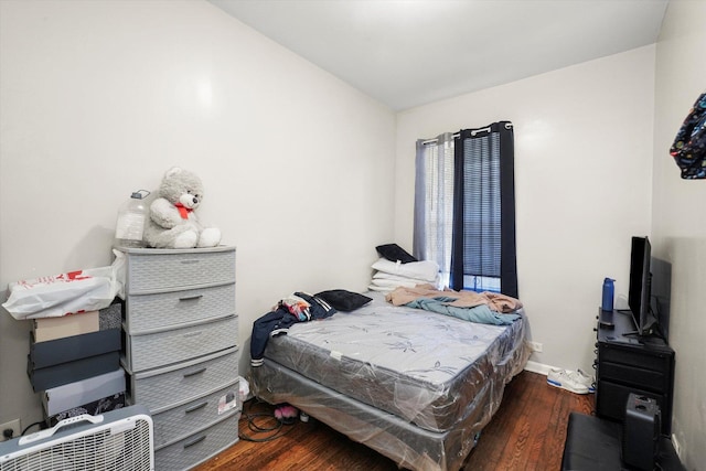 bedroom with wood finished floors