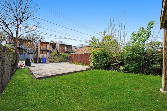 view of yard with a patio and fence
