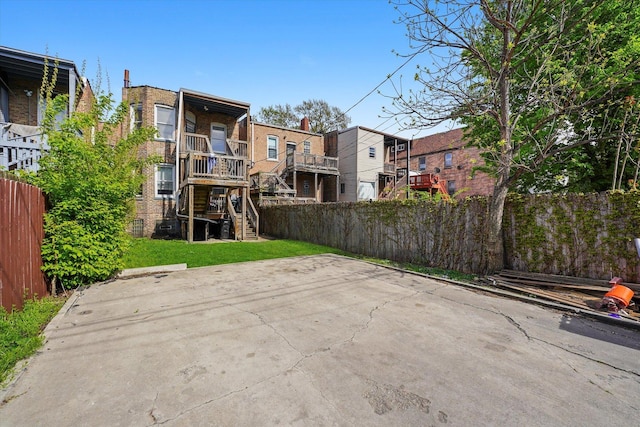 exterior space with stairs and fence