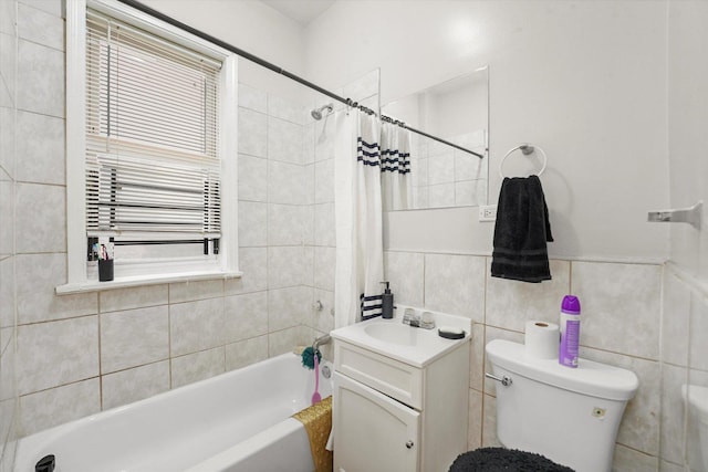 bathroom with toilet, radiator, shower / tub combo with curtain, tile walls, and vanity