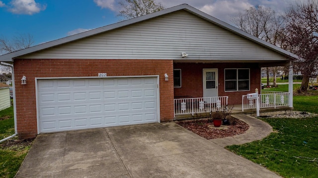 single story home featuring a porch, an attached garage, driveway, and brick siding