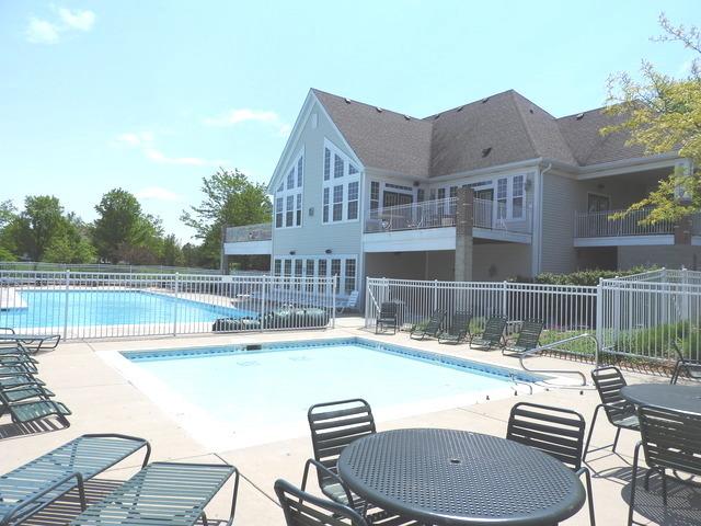 pool featuring fence and a patio
