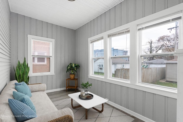 11945 S State St, Chicago, IL 60628 - living area with baseboards, wood finished floors, and a wealth of natural light