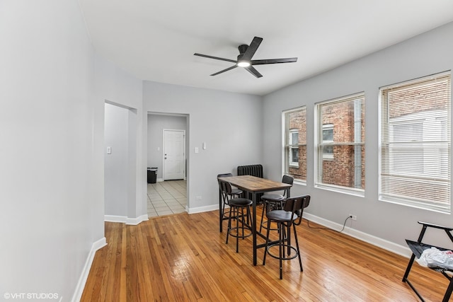 7204 S Cornell Ave, Chicago, IL 60649 - dining room with light wood finished floors, baseboards, and a ceiling fan