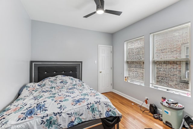 7204 S Cornell Ave, Chicago, IL 60649 - bedroom featuring baseboards, ceiling fan, and wood finished floors