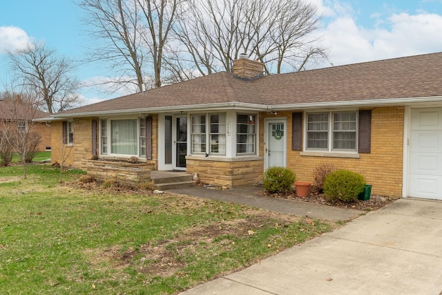 ranch-style home with concrete driveway, a chimney, a front lawn, brick siding, and a shingled roof