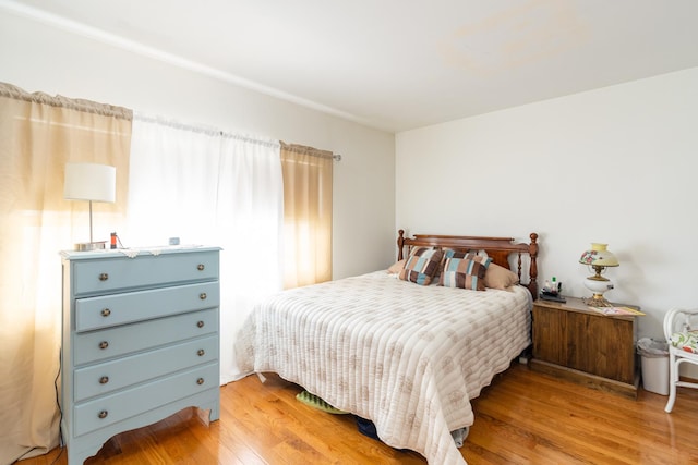 bedroom featuring wood finished floors