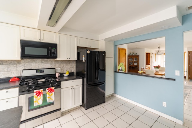 kitchen featuring dark countertops, backsplash, black appliances, and white cabinetry