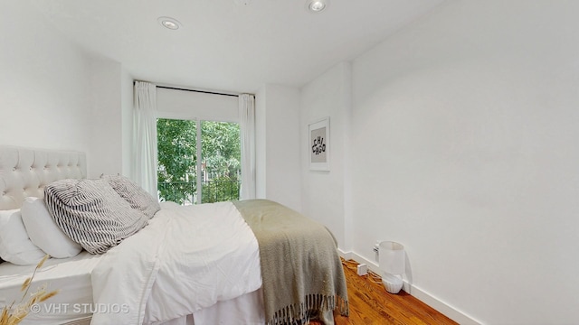 1341 N Wolcott Ave Unit A, Chicago, IL 60622 - bedroom with wood finished floors and recessed lighting