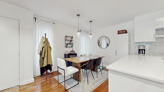 1341 N Wolcott Ave Unit A, Chicago, IL 60622 - dining area featuring light wood-style flooring and baseboards