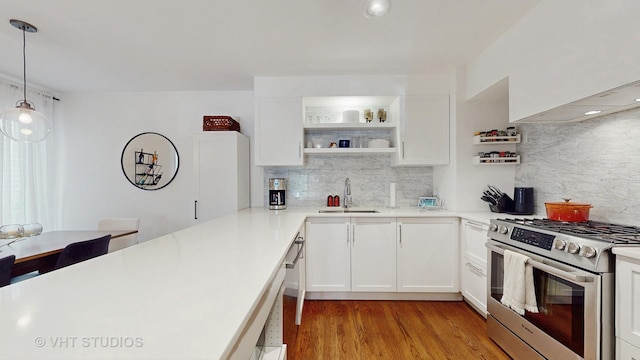 1341 N Wolcott Ave Unit A, Chicago, IL 60622 - kitchen featuring stainless steel gas range oven, tasteful backsplash, light countertops, and recessed lighting