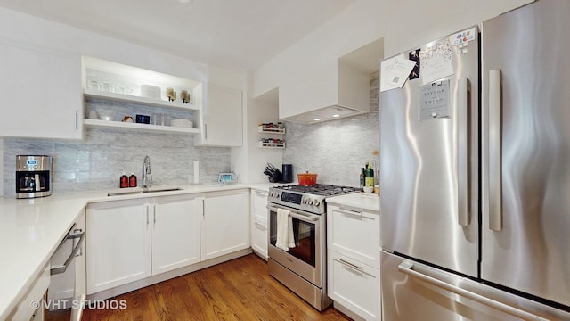 1341 N Wolcott Ave Unit A, Chicago, IL 60622 - kitchen with stainless steel appliances, backsplash, white cabinets, and light countertops