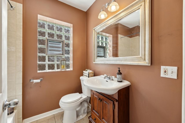 3418 N Oak Park Ave, Chicago, IL 60634 - bathroom with toilet, vanity, baseboards, and tile patterned flooring