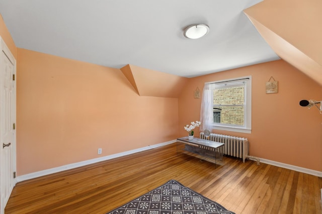 3418 N Oak Park Ave, Chicago, IL 60634 - bonus room featuring radiator, baseboards, lofted ceiling, and hardwood / wood-style flooring