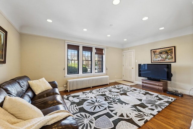 3418 N Oak Park Ave, Chicago, IL 60634 - living area featuring radiator heating unit, recessed lighting, and wood finished floors