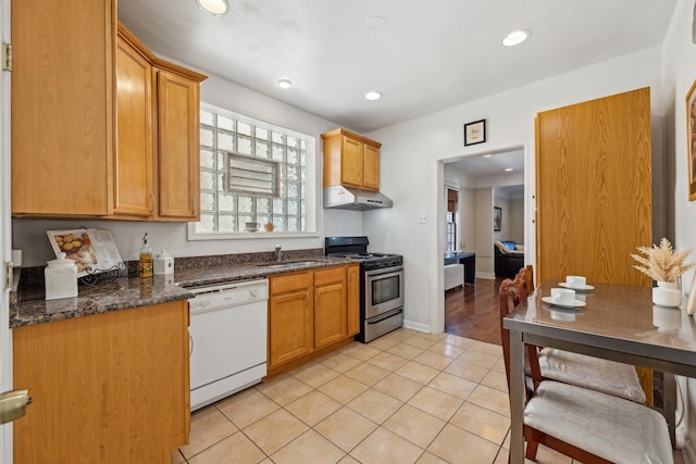 3418 N Oak Park Ave, Chicago, IL 60634 - kitchen featuring recessed lighting, light tile patterned flooring, under cabinet range hood, white dishwasher, and stainless steel range with gas cooktop