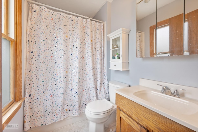 bathroom featuring vanity, tile patterned flooring, a shower with curtain, and toilet