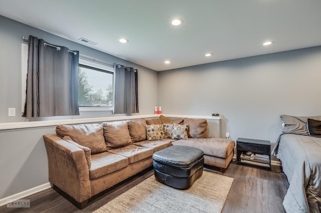 living area featuring recessed lighting, wood finished floors, and visible vents