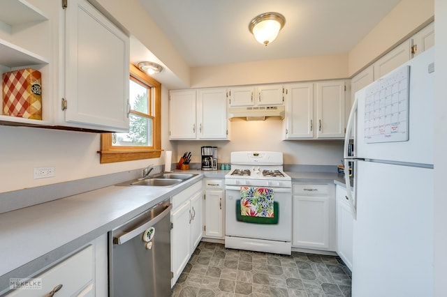 kitchen with a sink, under cabinet range hood, white cabinets, and white appliances