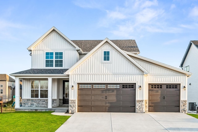modern inspired farmhouse with board and batten siding, stone siding, and concrete driveway