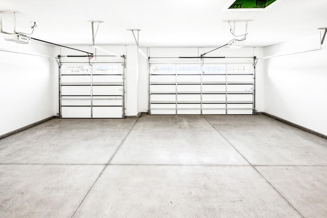 garage featuring baseboards and a garage door opener