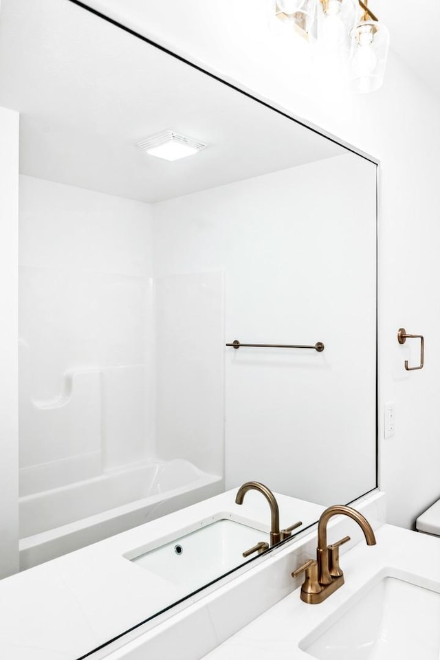 full bathroom with a sink