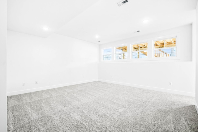 empty room with visible vents, baseboards, recessed lighting, and carpet flooring
