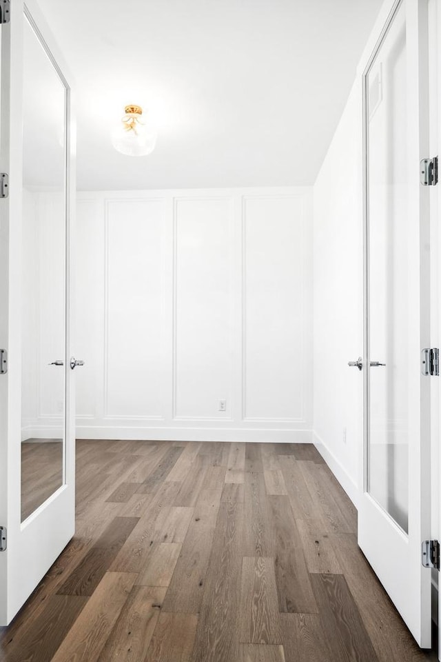 spare room with wood finished floors