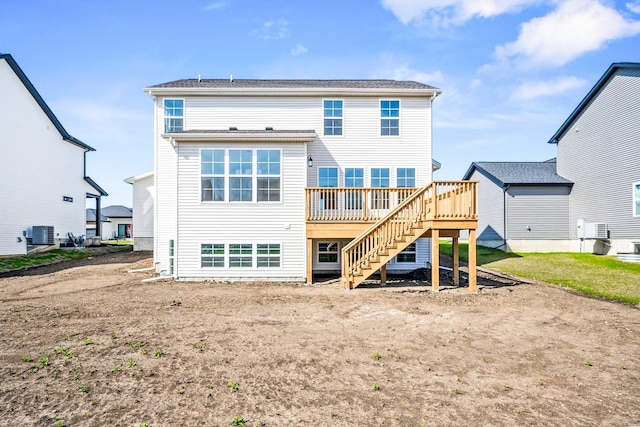 back of house with stairs, central AC unit, and a deck