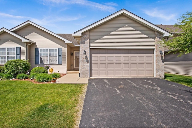 411 Anjali Ct, Sycamore, IL 60178 - ranch-style house with driveway, a front lawn, and an attached garage