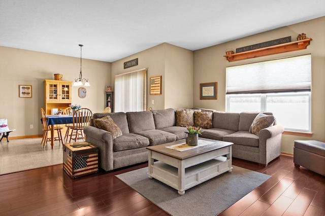 411 Anjali Ct, Sycamore, IL 60178 - living area featuring plenty of natural light, a chandelier, and dark wood-style flooring