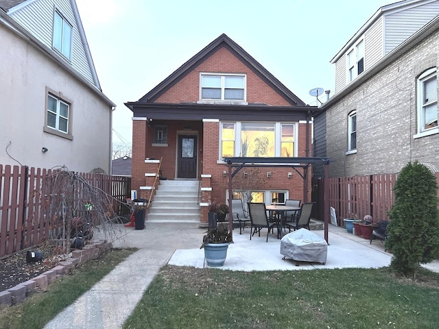 5810 W 64th Pl, Chicago, IL 60638 - rear view of house with brick siding, entry steps, a fenced backyard, and a patio