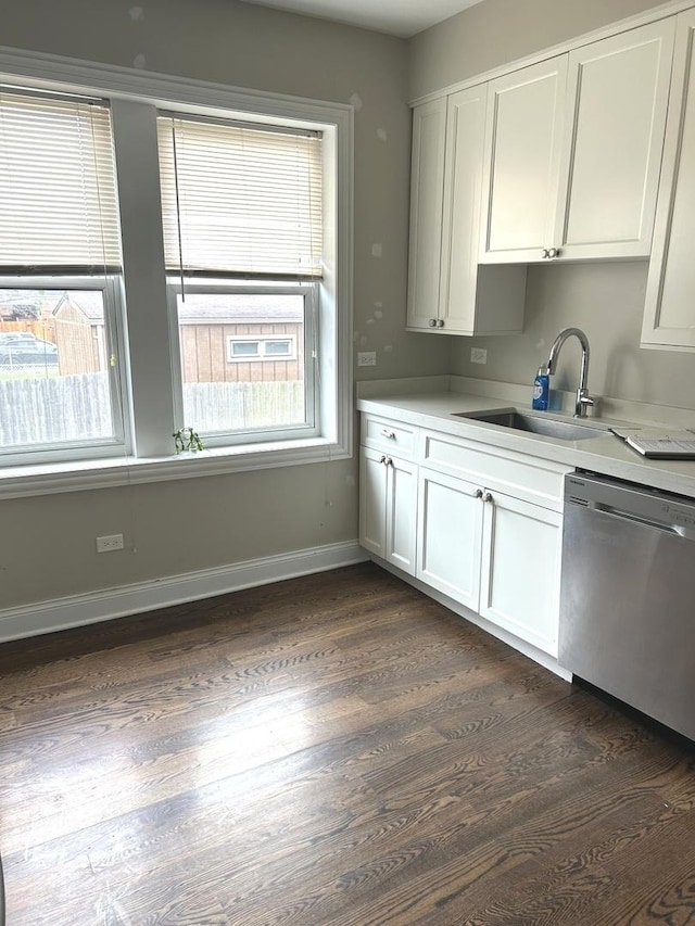 5810 W 64th Pl, Chicago, IL 60638 - kitchen featuring stainless steel dishwasher, a sink, dark wood-style floors, and healthy amount of natural light