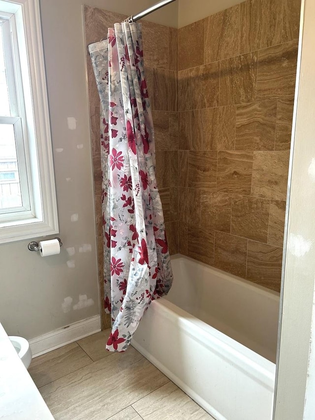 5810 W 64th Pl, Chicago, IL 60638 - bathroom with shower / bath combo with shower curtain and baseboards