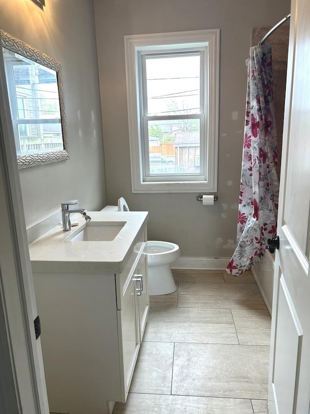 5810 W 64th Pl, Chicago, IL 60638 - bathroom featuring vanity, tile patterned flooring, toilet, and baseboards