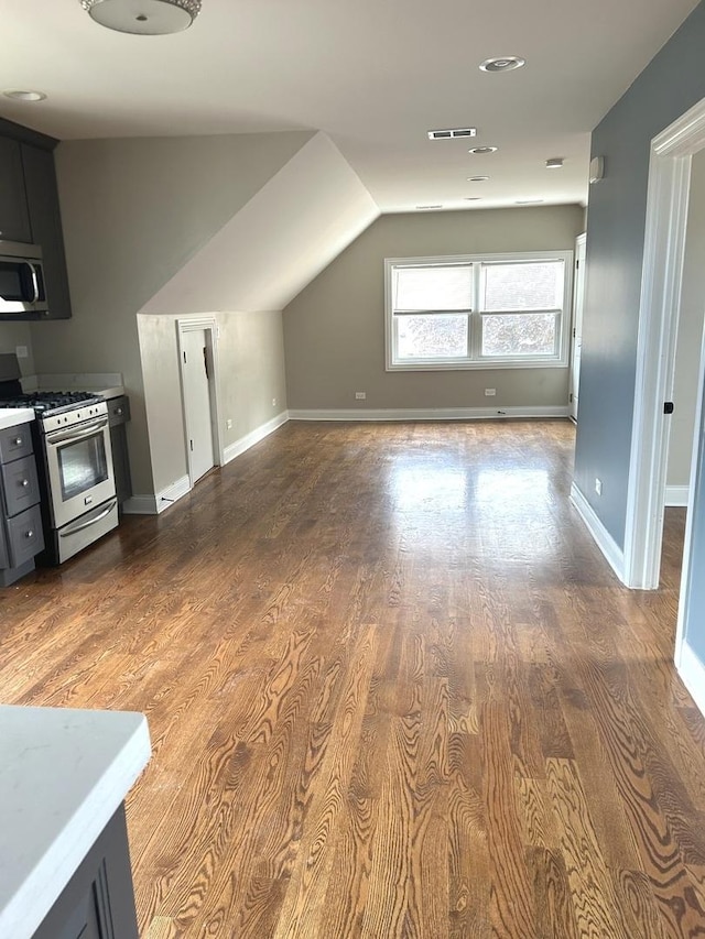 5810 W 64th Pl, Chicago, IL 60638 - bonus room featuring dark wood-style floors, baseboards, and lofted ceiling