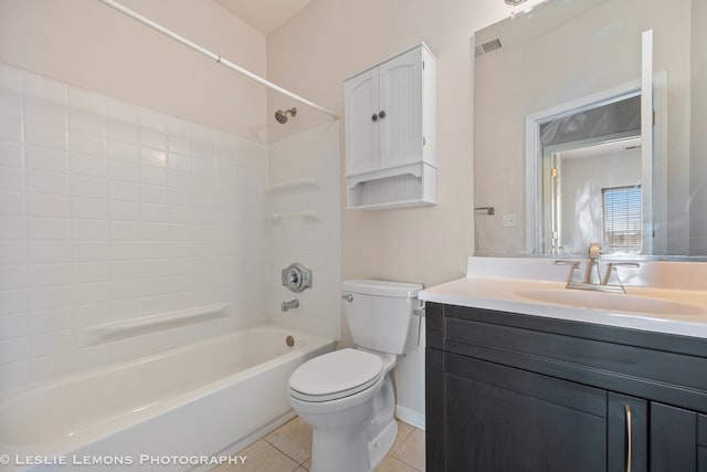 bathroom with vanity, tile patterned floors, toilet, visible vents, and bathtub / shower combination
