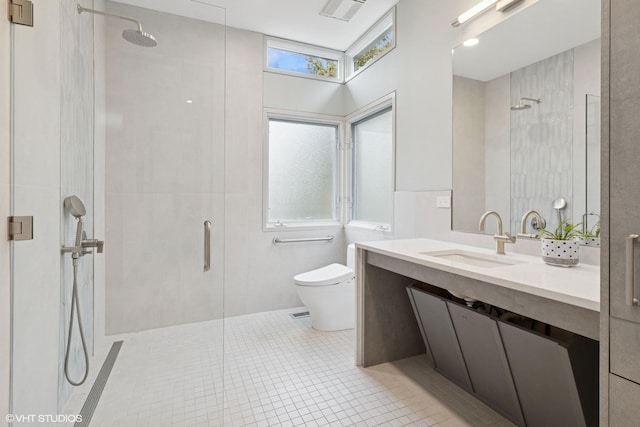 bathroom featuring an enclosed shower, toilet, and visible vents