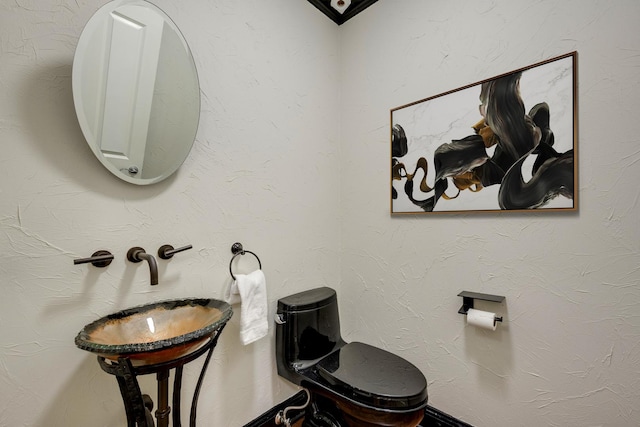 bathroom featuring toilet