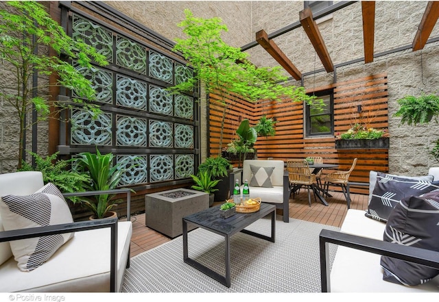 view of patio / terrace featuring outdoor dining space, a deck, and an outdoor living space
