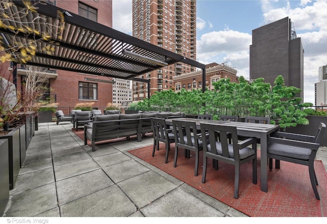 view of patio / terrace with an outdoor hangout area, a city view, and outdoor dining area