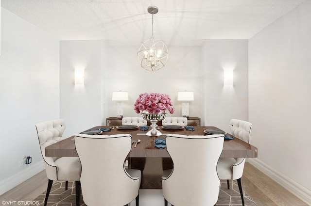 195 N Harbor Dr Unit 2602, Chicago, IL 60601 - dining room with baseboards, an inviting chandelier, and wood finished floors