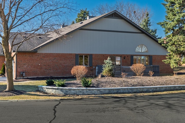 view of front of home with brick siding