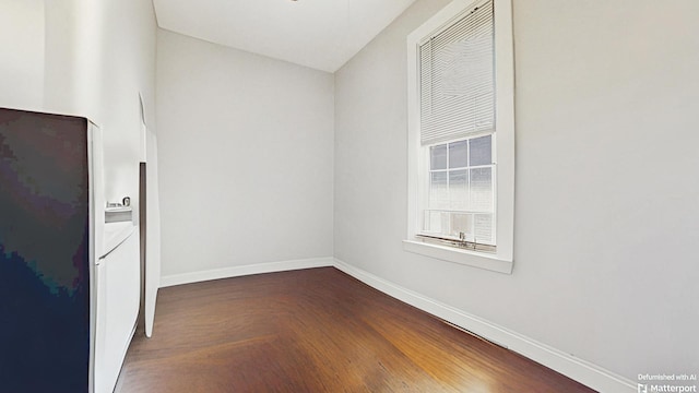 empty room featuring baseboards