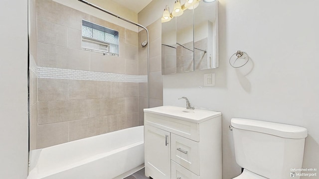 full bath featuring toilet, vanity, and shower / bathtub combination