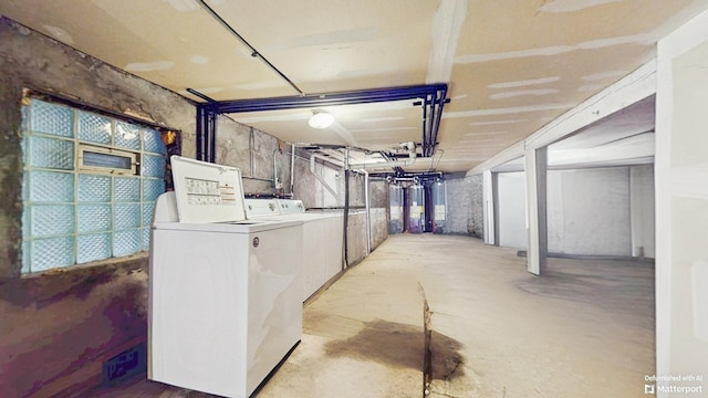 unfinished basement with washing machine and dryer