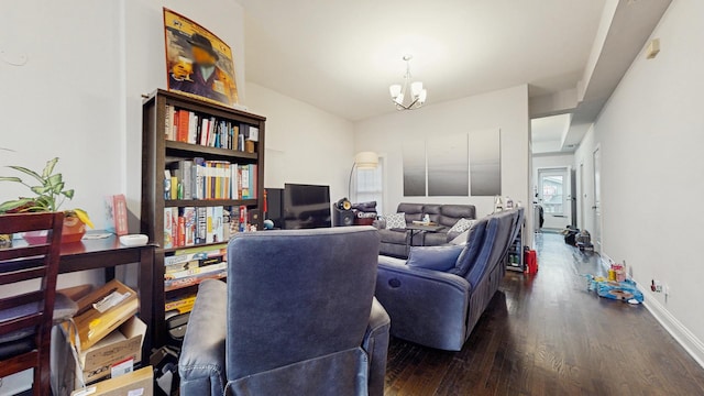 home office featuring baseboards, an inviting chandelier, and wood finished floors