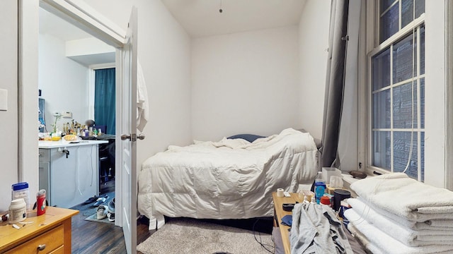 bedroom featuring wood finished floors