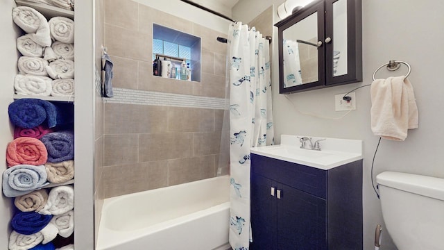 bathroom featuring toilet, shower / bathtub combination with curtain, and vanity