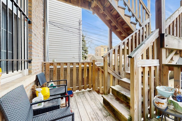 wooden terrace featuring stairs